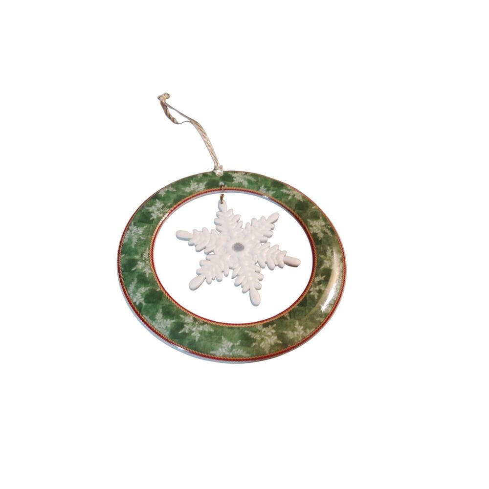 The Winter Festival pattern by Wedgwood features a green rim, snowflakes